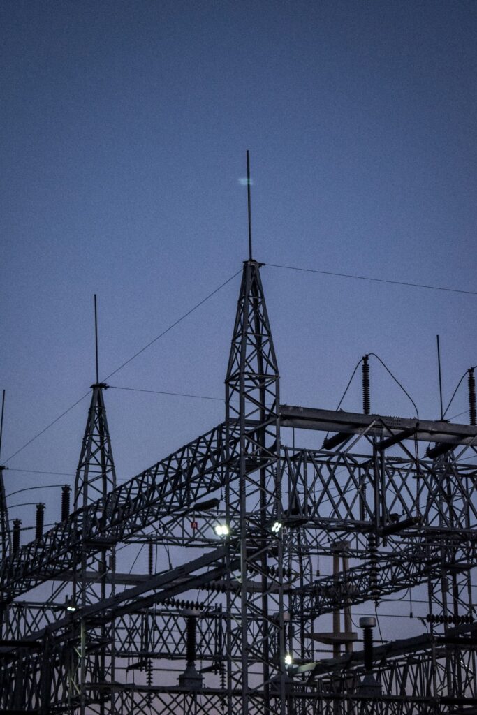 Electrical substation steelwork against a dusk sky